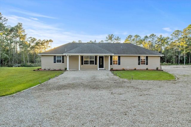 single story home featuring a front lawn