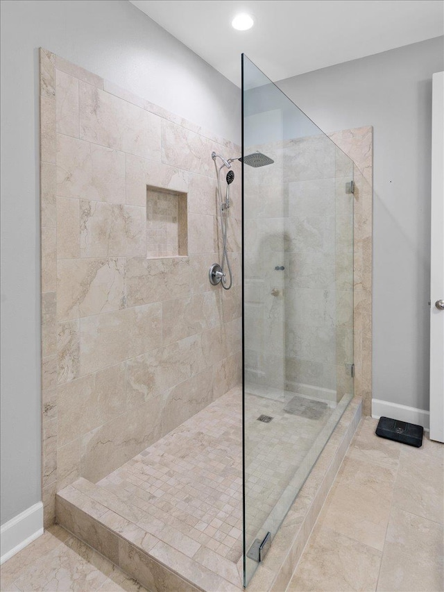 bathroom with tiled shower