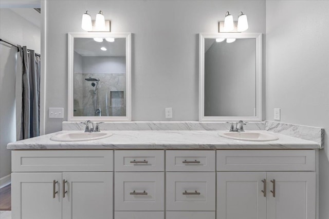 bathroom with vanity and a shower with shower door