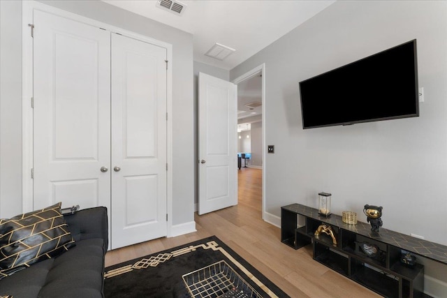 living room with light hardwood / wood-style flooring