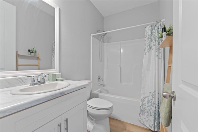 full bathroom with vanity, shower / bath combination with curtain, and toilet