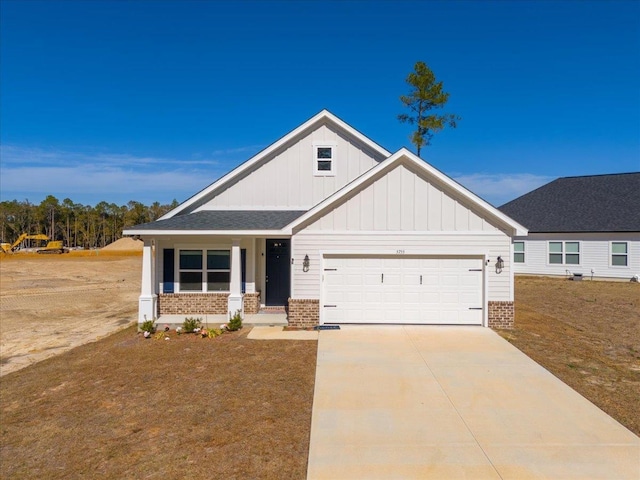 craftsman-style home featuring a garage and covered porch