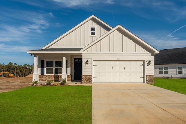 craftsman house featuring a garage, a porch, and a front yard