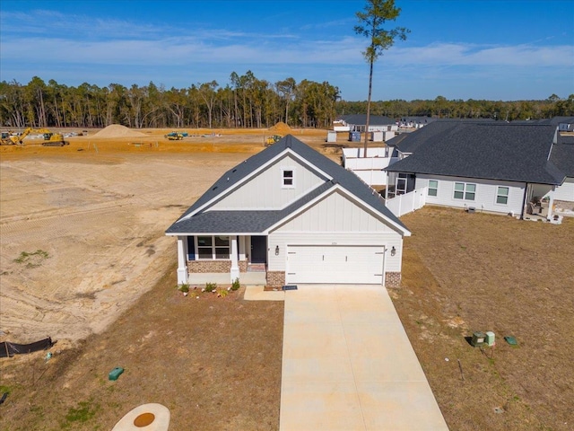 view of front of house with a garage and a porch