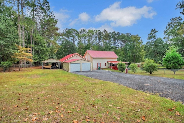 2875 Cooks Landing Rd, Quincy, FL 32351 - view of front facade with a garage, an outbuilding, and metal roof