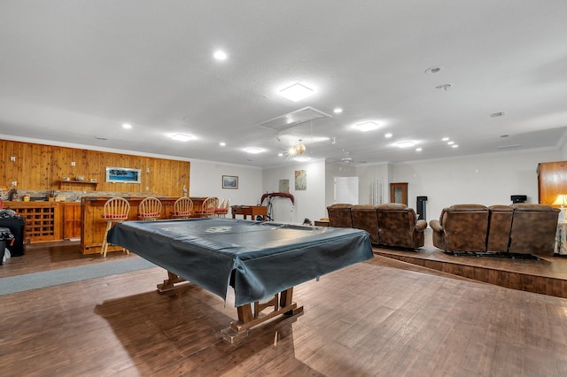 playroom with wood walls, billiards, bar, crown molding, and light wood-type flooring