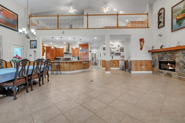2875 Cooks Landing Rd, Quincy, FL 32351 - living area featuring high vaulted ceiling, a fireplace, light tile patterned floors, a chandelier, and a ceiling fan
