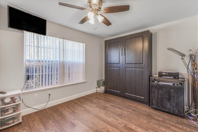 bedroom with hardwood / wood-style flooring and ceiling fan