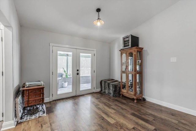 entryway with dark hardwood / wood-style floors and french doors