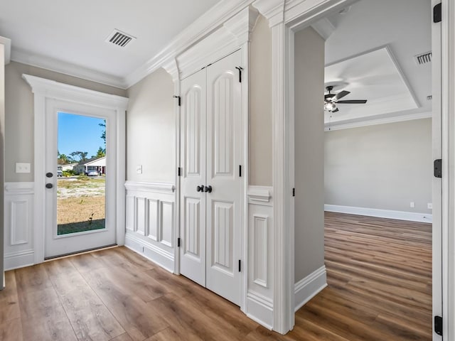 interior space featuring hardwood / wood-style floors and ornamental molding