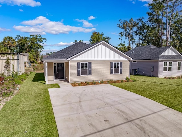 rear view of property featuring a yard