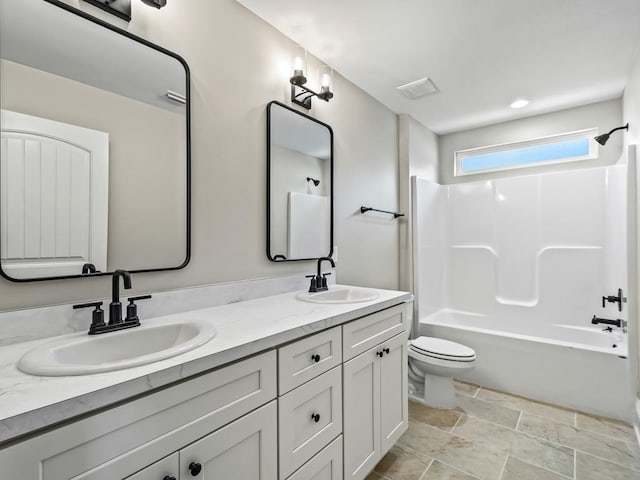 full bathroom with toilet, shower / bathing tub combination, and vanity