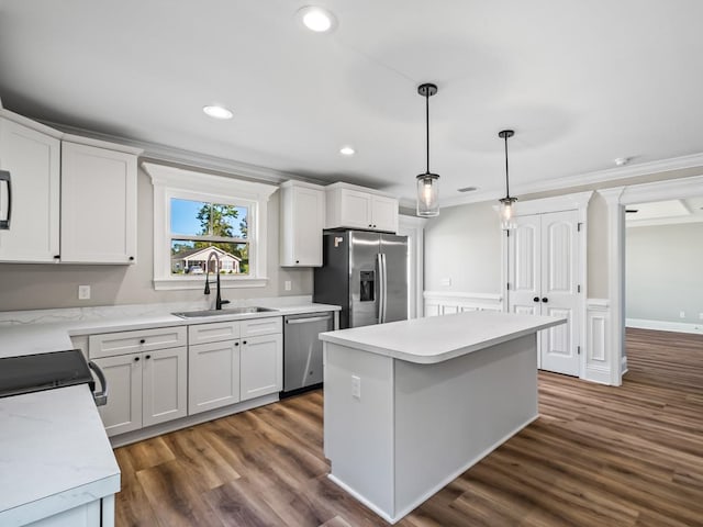 kitchen with white cabinets, sink, dark hardwood / wood-style floors, and stainless steel appliances