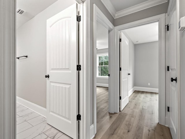 hallway featuring crown molding