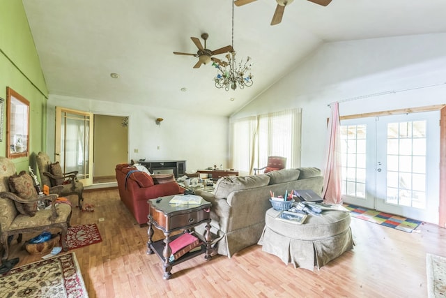 living room with lofted ceiling, french doors, ceiling fan, and light hardwood / wood-style flooring