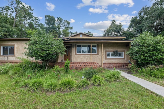 view of front of home with a front yard