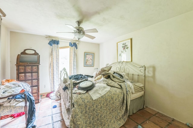 bedroom with tile patterned flooring and ceiling fan