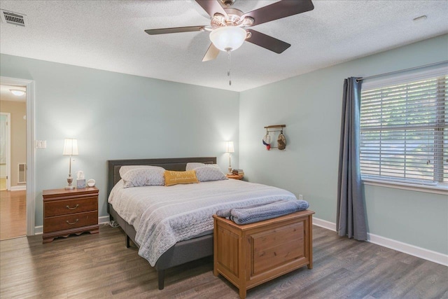 6447 Joe Cotton Trl, Tallahassee, FL 32309 - bedroom with wood finished floors, a textured ceiling, baseboards, and ceiling fan
