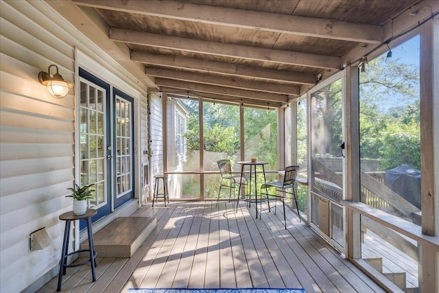 6447 Joe Cotton Trl, Tallahassee, FL 32309 - unfurnished sunroom with beam ceiling and plenty of natural light