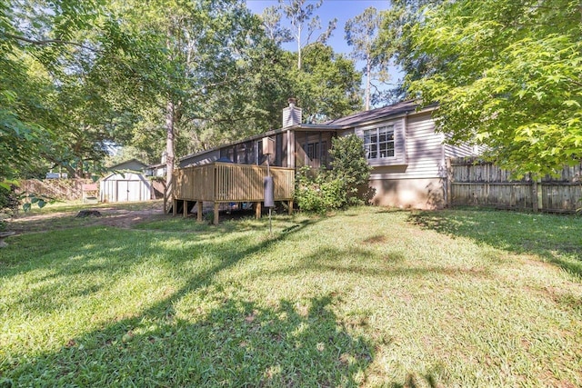 6447 Joe Cotton Trl, Tallahassee, FL 32309 - back of house featuring a shed, an outbuilding, a chimney, and a wooden deck