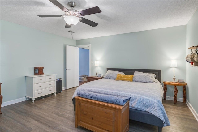 6447 Joe Cotton Trl, Tallahassee, FL 32309 - bedroom with wood finished floors, baseboards, a ceiling fan, and a textured ceiling