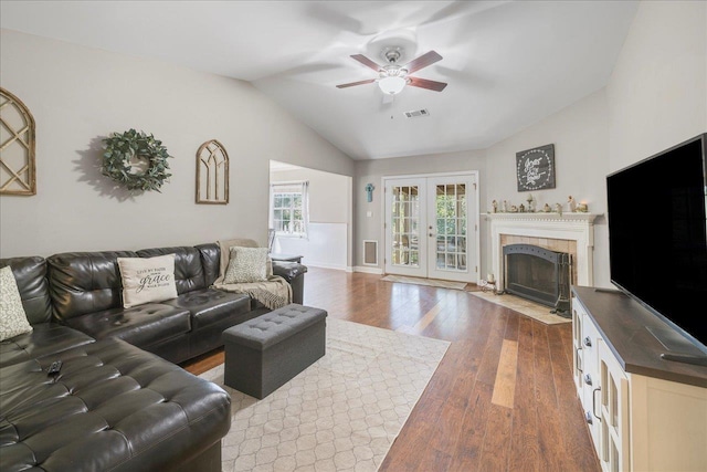 6447 Joe Cotton Trl, Tallahassee, FL 32309 - living room with wood finished floors, ceiling fan, vaulted ceiling, a premium fireplace, and french doors
