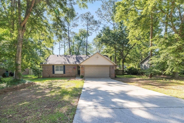 6447 Joe Cotton Trl, Tallahassee, FL 32309 - ranch-style house with an attached garage, concrete driveway, brick siding, and a front lawn
