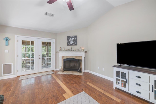 6447 Joe Cotton Trl, Tallahassee, FL 32309 - unfurnished living room featuring french doors, a ceiling fan, baseboards, wood finished floors, and vaulted ceiling