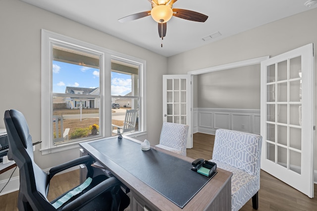 office space with dark wood-type flooring, ceiling fan, and french doors