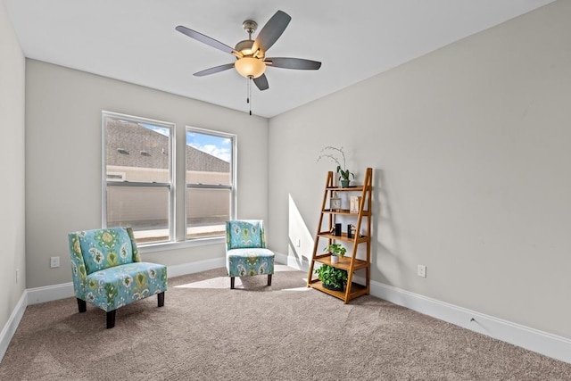 sitting room featuring ceiling fan and carpet flooring