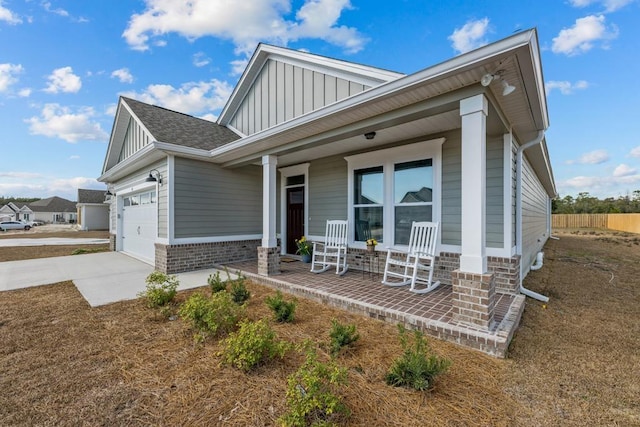 view of front of property featuring a porch and a garage