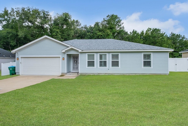 view of front of house featuring a garage and a front yard