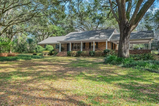 ranch-style house with a front lawn