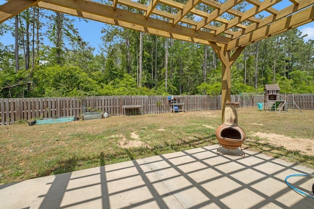 view of patio with a fenced backyard, a playground, and a pergola