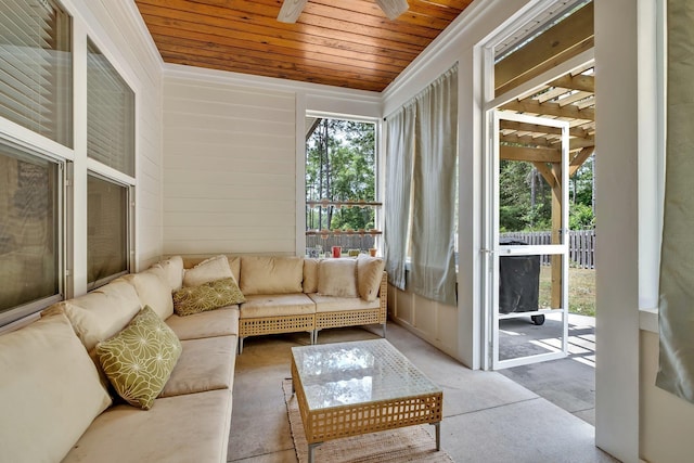 sunroom featuring ceiling fan and an outdoor hangout area