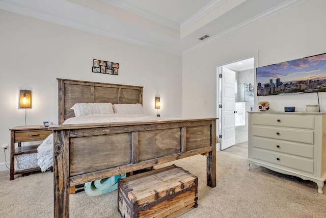 bedroom featuring visible vents, ornamental molding, a tray ceiling, and light colored carpet