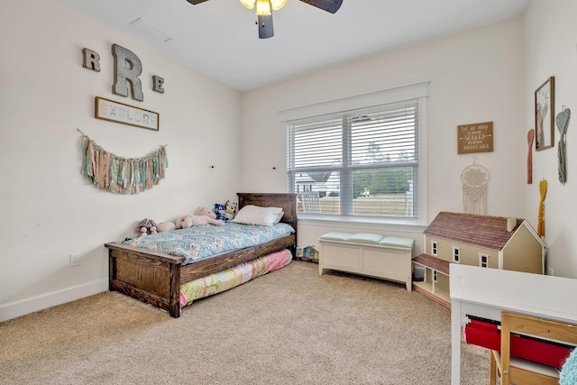 carpeted bedroom with baseboards and ceiling fan