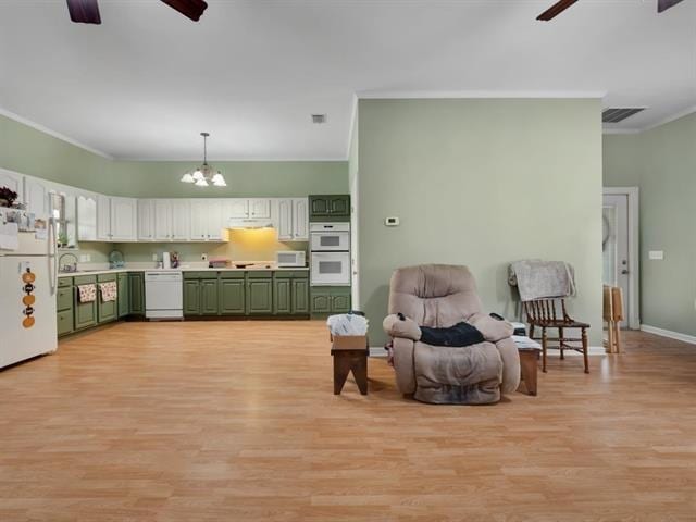 interior space featuring ornamental molding, light wood-type flooring, and ceiling fan with notable chandelier