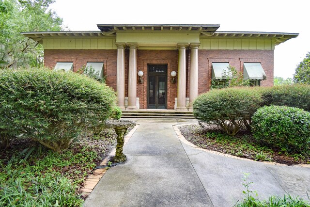 doorway to property featuring covered porch