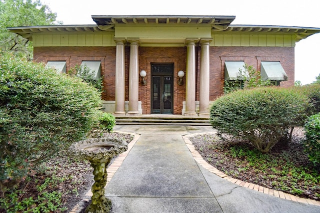 doorway to property featuring covered porch