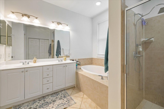 bathroom featuring tile patterned flooring, vanity, and independent shower and bath