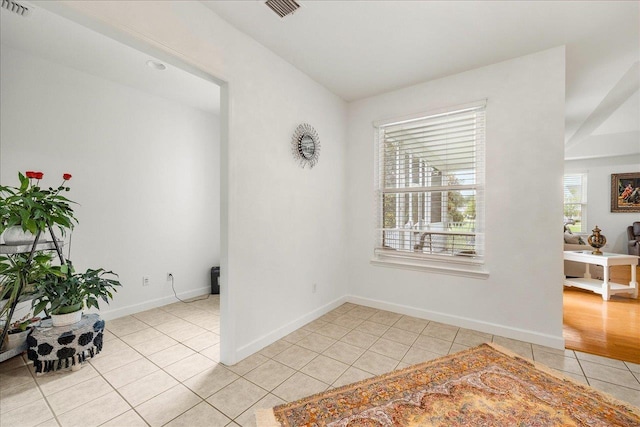 spare room featuring light tile patterned floors