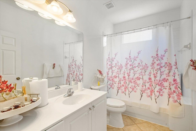 full bathroom featuring tile patterned floors, shower / bath combination with curtain, toilet, and vanity