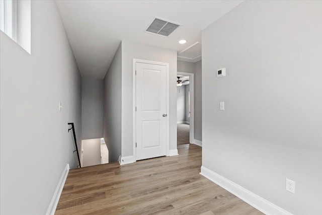 interior space with visible vents, baseboards, and light wood-style flooring