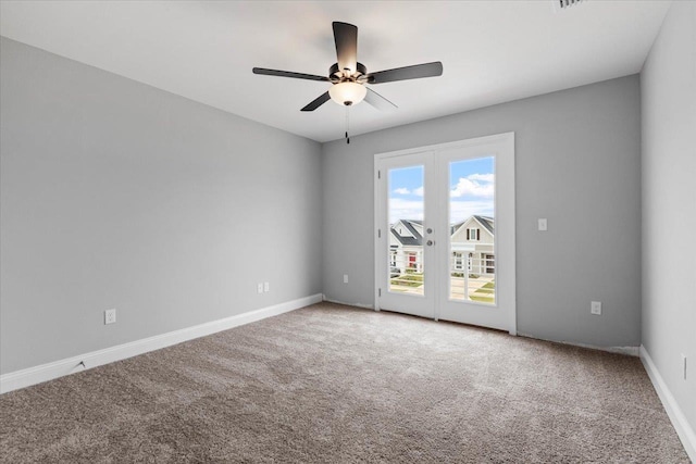 unfurnished room featuring ceiling fan, french doors, baseboards, and carpet