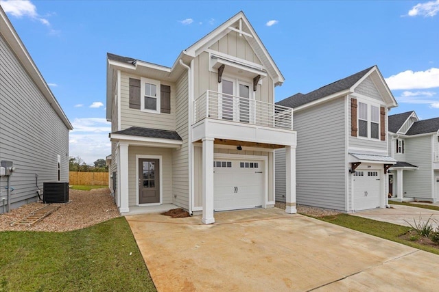 view of front of property with a balcony, an attached garage, central AC, concrete driveway, and board and batten siding