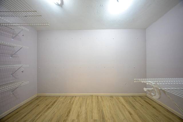 spacious closet featuring wood finished floors