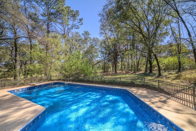 view of swimming pool featuring fence and a fenced in pool