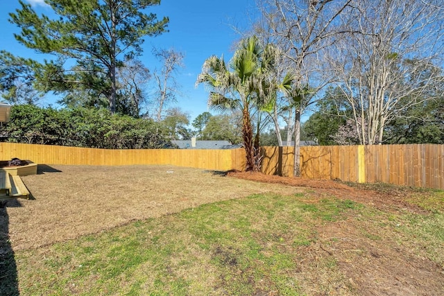 view of yard with a fenced backyard