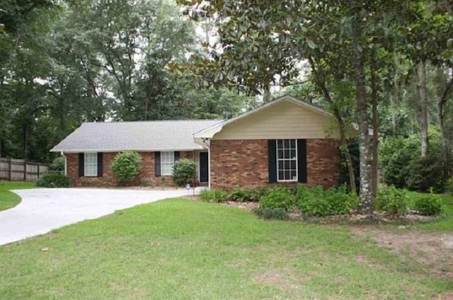 ranch-style house with a front lawn